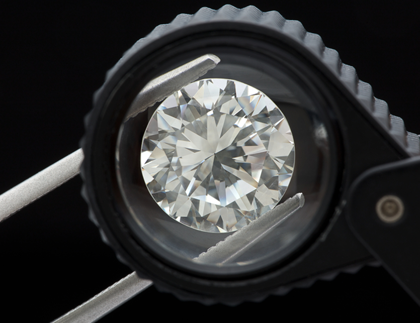 Round lab-grown diamond under inspection